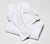 Two Essential White Classic bath towels with white background.
