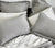 Six Down Pillows dressed in Percale Pillow Cases and Softexture shams on a bed with Percale Sheets.