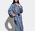 Woman modeling the Slate Blue Classic Bathrobe with white background.