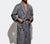 Man modeling the Charcoal Grey Classic Bathrobe with white background.