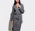 Woman dressed in Charcoal Grey Honeycomb Bathrobe with white background.