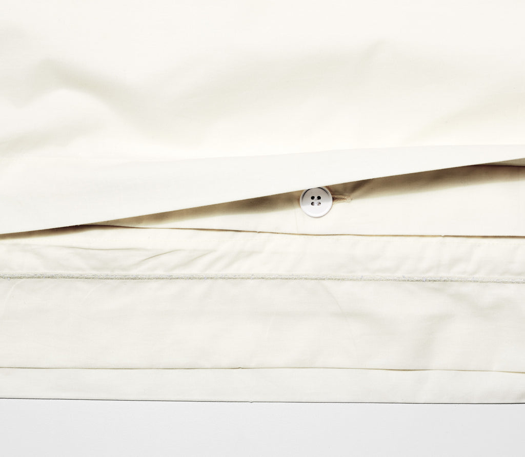 Close up of Classic Ivory Percale Duvet Cover showing texture and inside buttons.