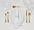 One table setting featuring Brushed Gold Flatware Setting, Dinner and Appetizer Plates with a white napkin and Wine Glasses.