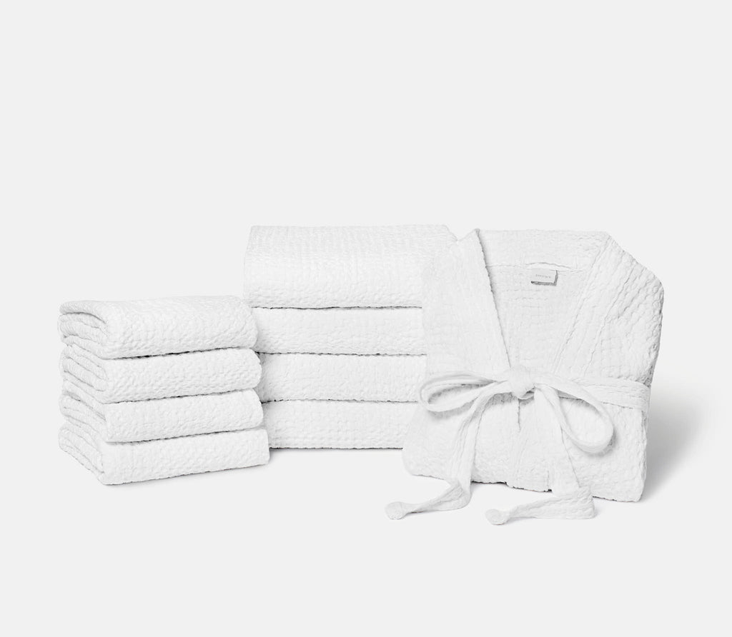 set of white bath towel and white bathrobe