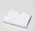 Folded Essential White Bath Towel with white background.