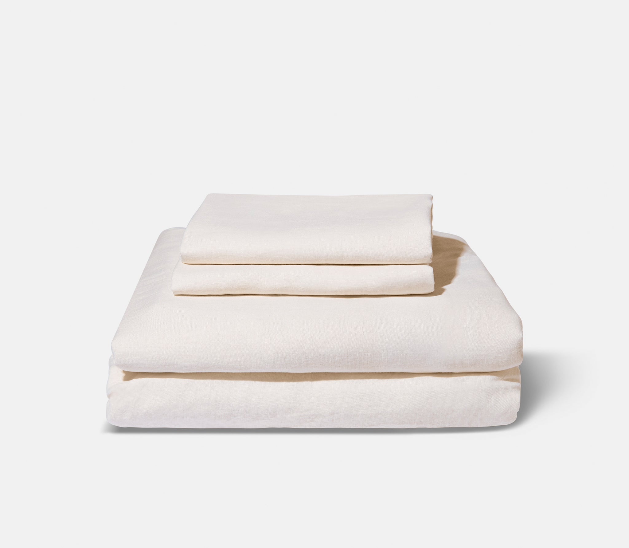 Folded ivory linen sheets
