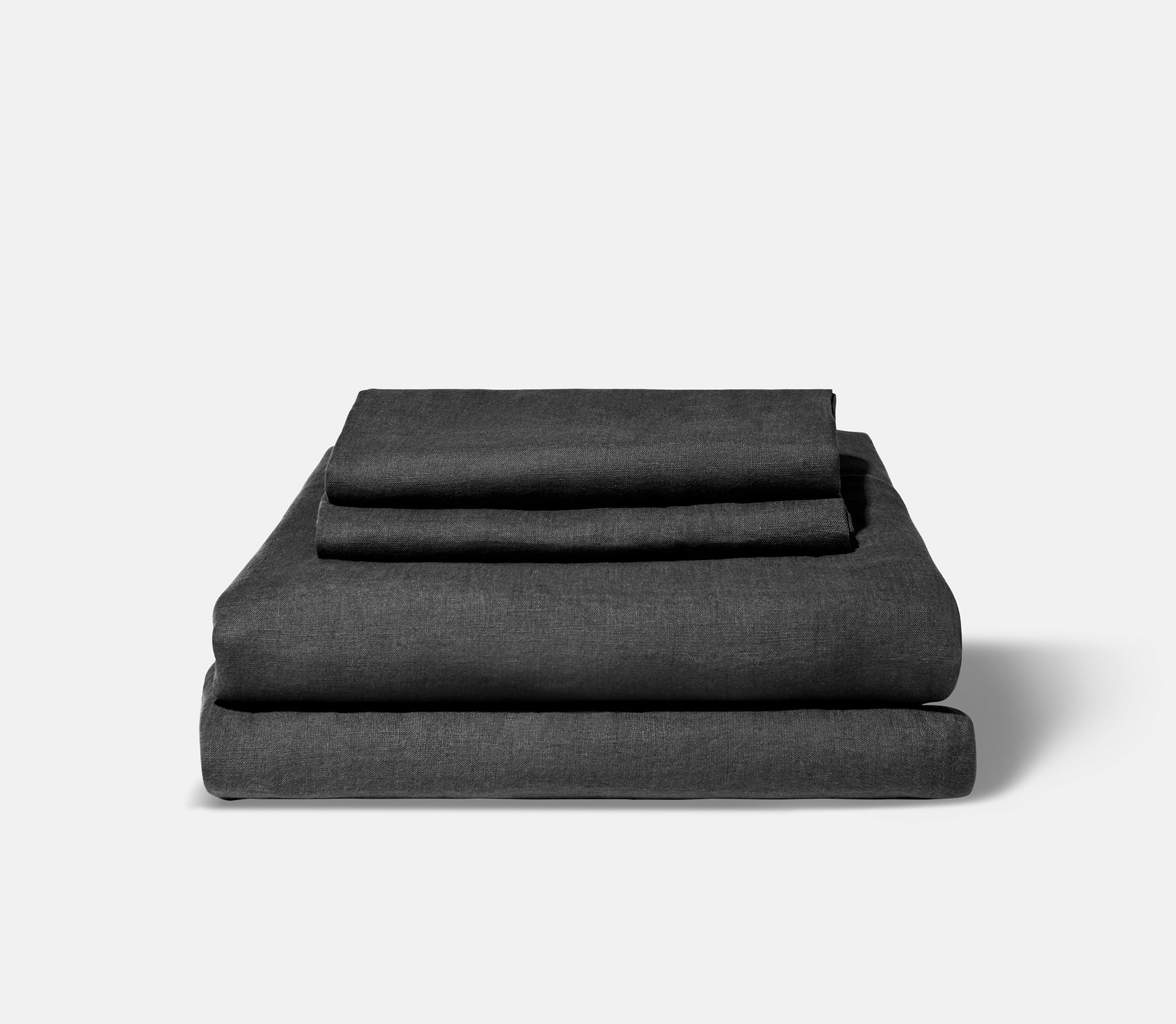 Folded noir linen sheets.